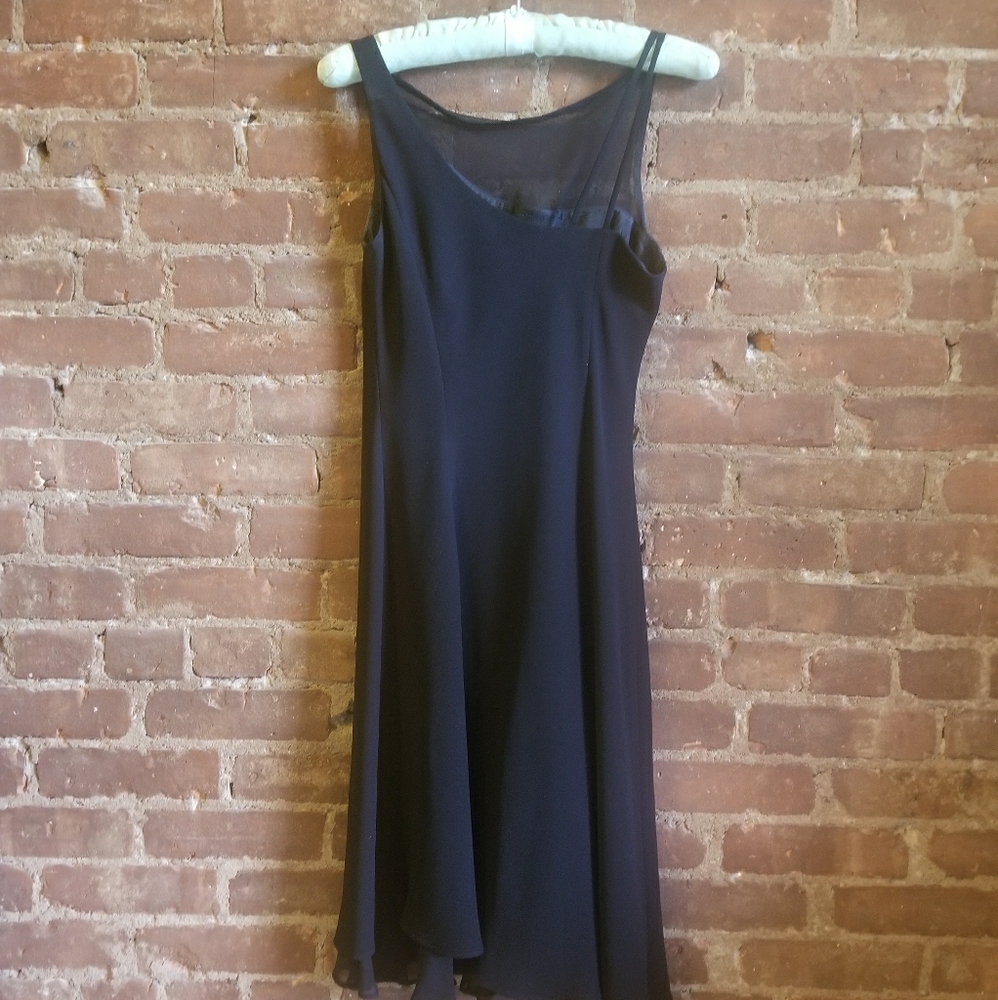 Black cocktail dress with sheer neckline